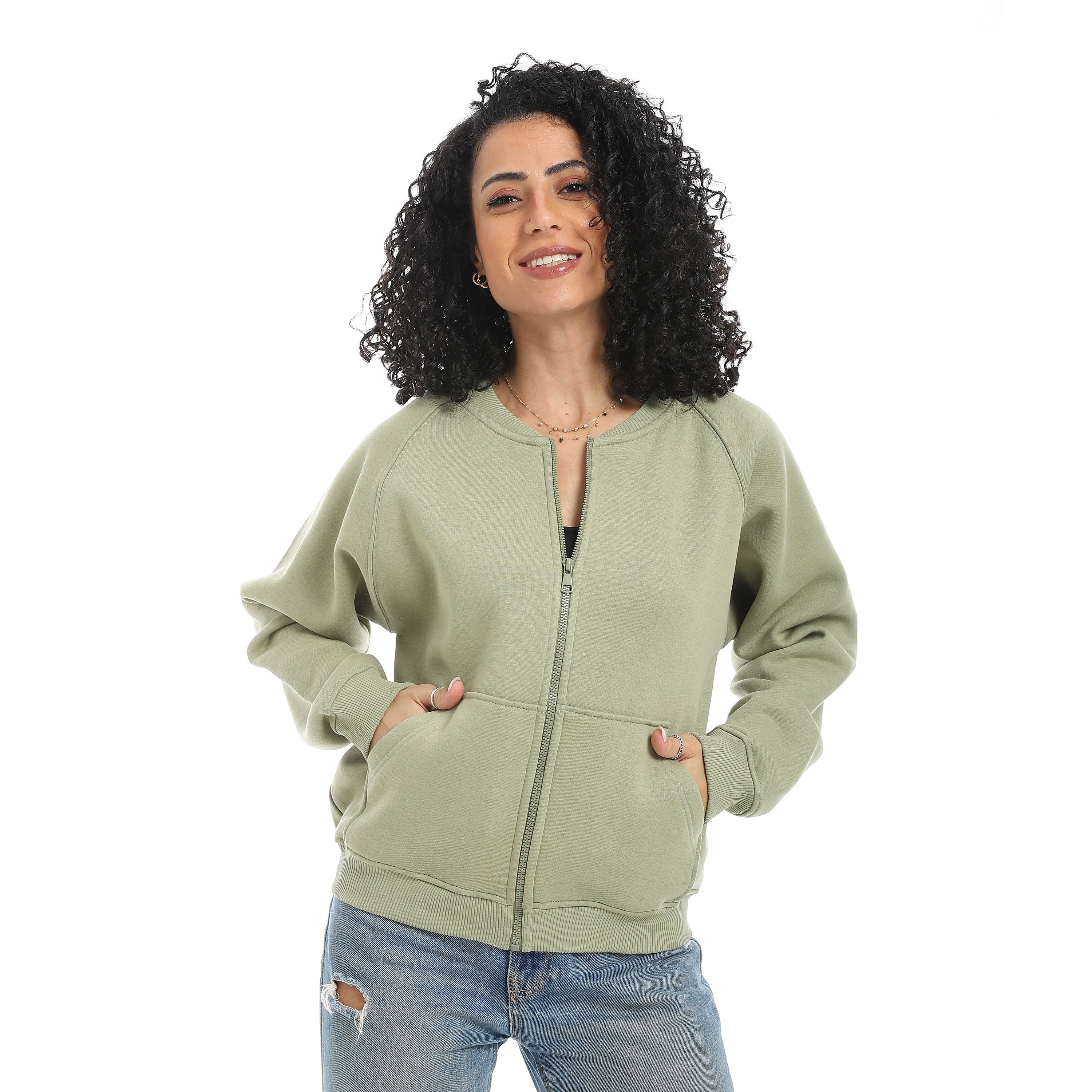 Woman wearing a green hoodie on a white background